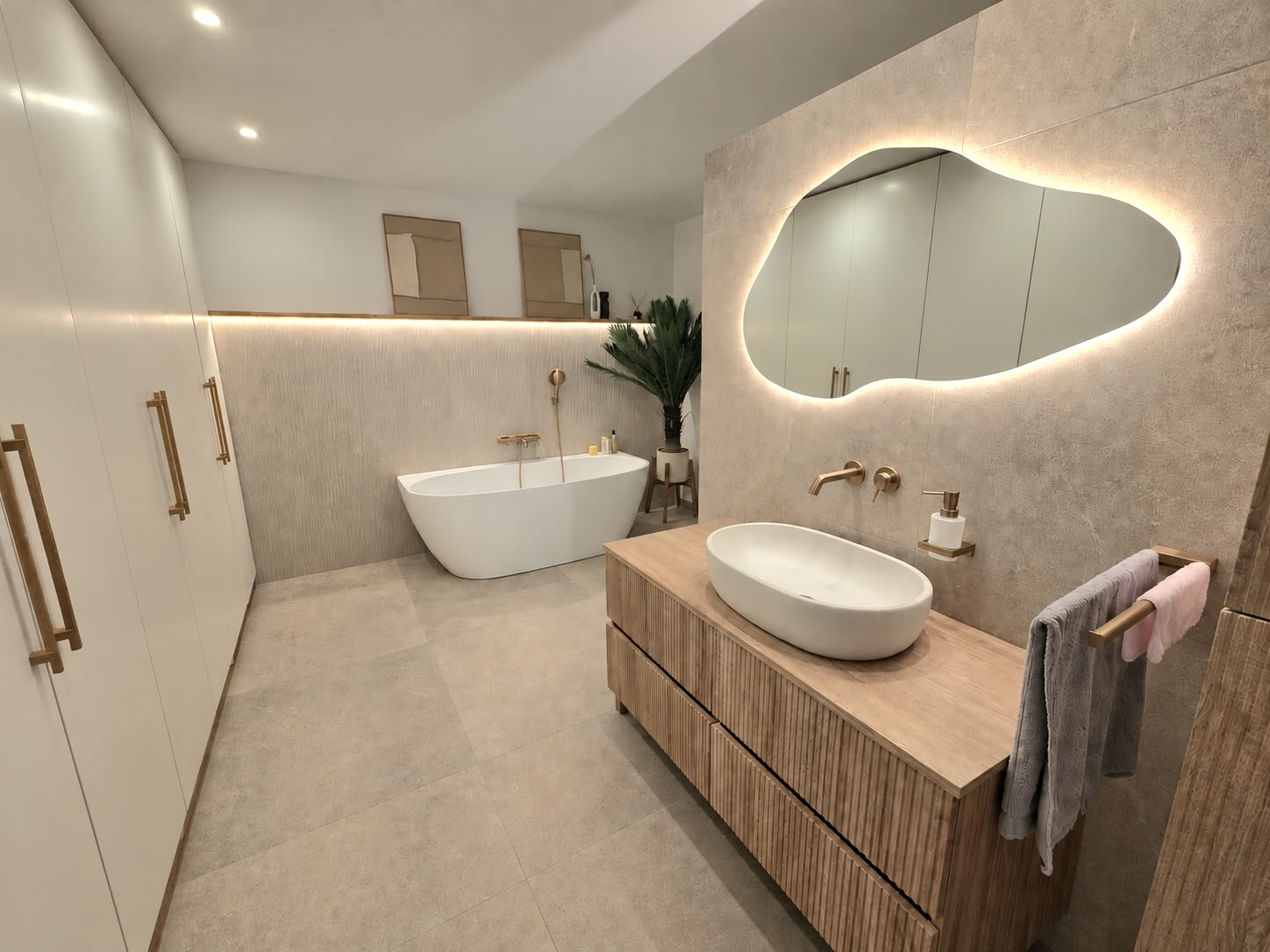 Two bathrooms · warm stone and natural wood